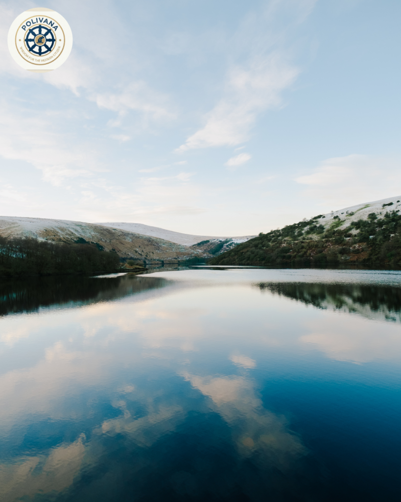 “Mental Swaraj: Why True Freedom Begins Within” “A black and white minimalist photograph of a calm lake reflecting a distant mountain, symbolizing a peaceful and self-governed mind.”